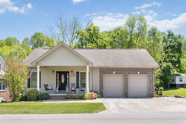 ranch-style house with a garage, concrete driveway, a porch, and brick siding