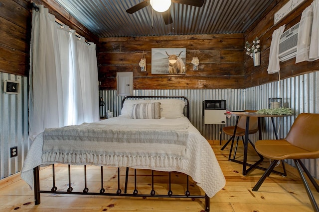 bedroom with hardwood / wood-style flooring