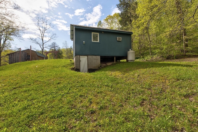 back of property featuring a lawn