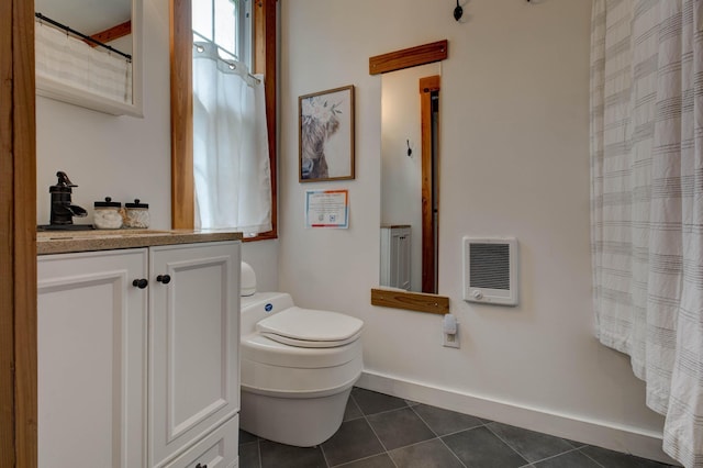 full bath featuring tile patterned flooring, baseboards, vanity, toilet, and heating unit