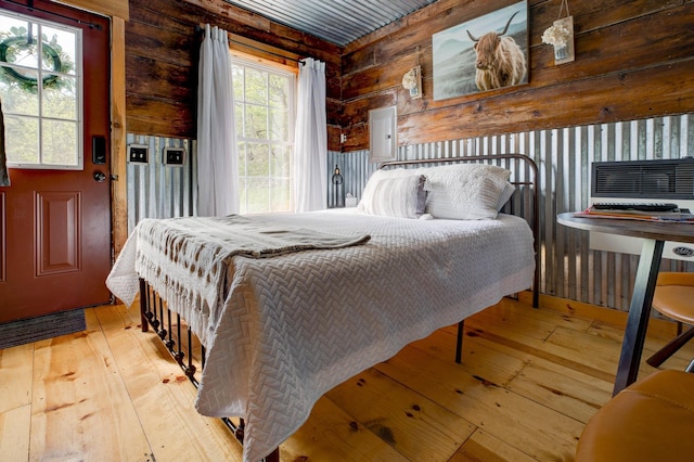 bedroom with wood-type flooring