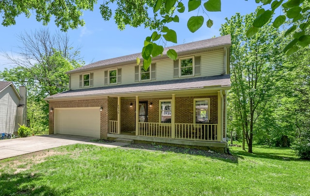 4805 Laurel Creek Cir, Lexington, KY 40515 - view of front of house with a porch, brick siding, driveway, a garage, and a front lawn