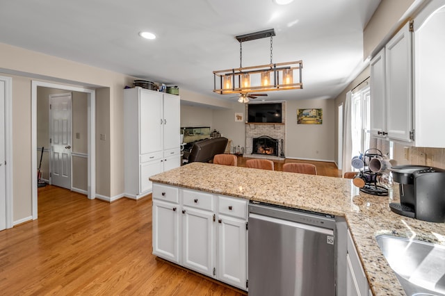 4805 Laurel Creek Cir, Lexington, KY 40515 - kitchen with dishwasher, a fireplace, open floor plan, white cabinets, and recessed lighting