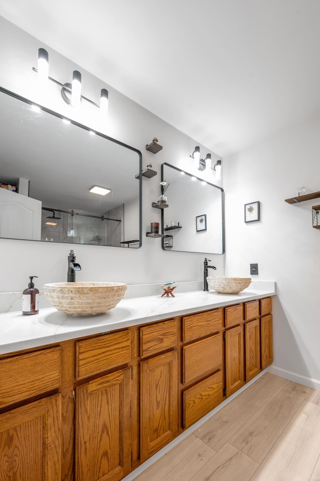 4805 Laurel Creek Cir, Lexington, KY 40515 - full bathroom featuring wood finished floors, double vanity, and a walk in shower