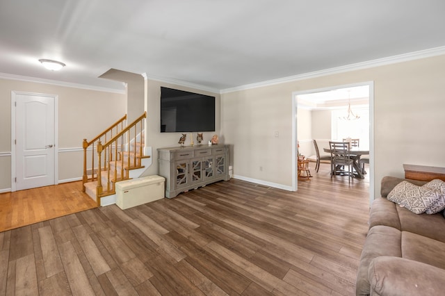4805 Laurel Creek Cir, Lexington, KY 40515 - living room featuring wood finished floors, crown molding, stairs, baseboards, and a chandelier