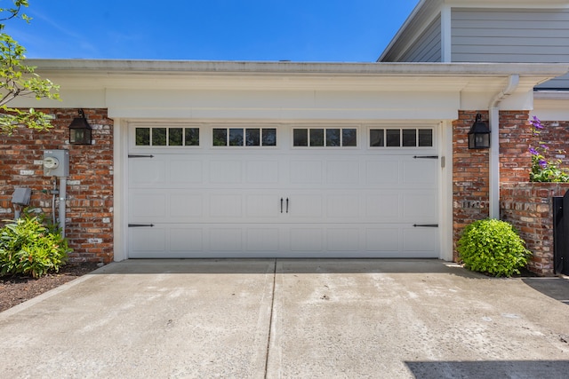 garage with concrete driveway