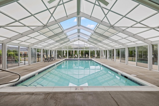 community pool with fence and a patio area
