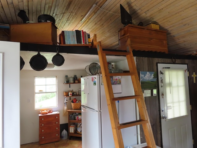 4362 Poor Ridge Pike, Lancaster, KY 40444 - kitchen featuring freestanding refrigerator, wood walls, and wooden ceiling