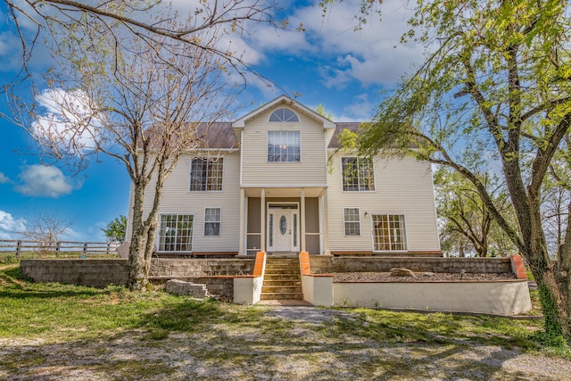 traditional home with fence
