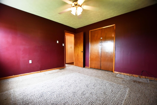 215 Stacy Lane Rd, Irvine, KY 40336 - unfurnished bedroom with carpet, baseboards, a closet, and a ceiling fan