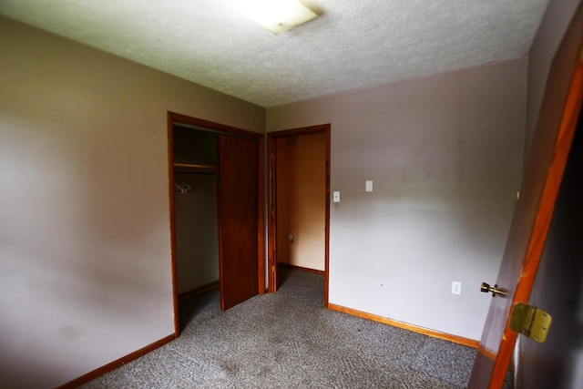 215 Stacy Lane Rd, Irvine, KY 40336 - unfurnished bedroom featuring carpet floors, baseboards, a textured ceiling, and a closet