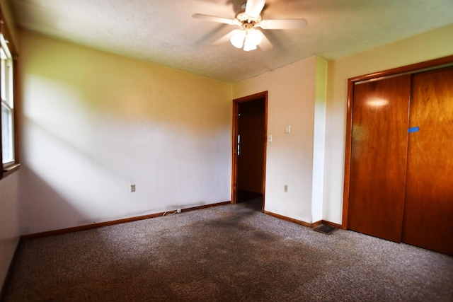 215 Stacy Lane Rd, Irvine, KY 40336 - unfurnished bedroom with carpet floors, baseboards, ceiling fan, and a closet