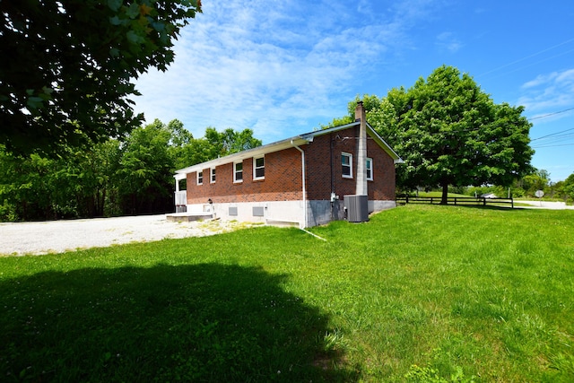 215 Stacy Lane Rd, Irvine, KY 40336 - rear view of house with central AC, brick siding, and a chimney