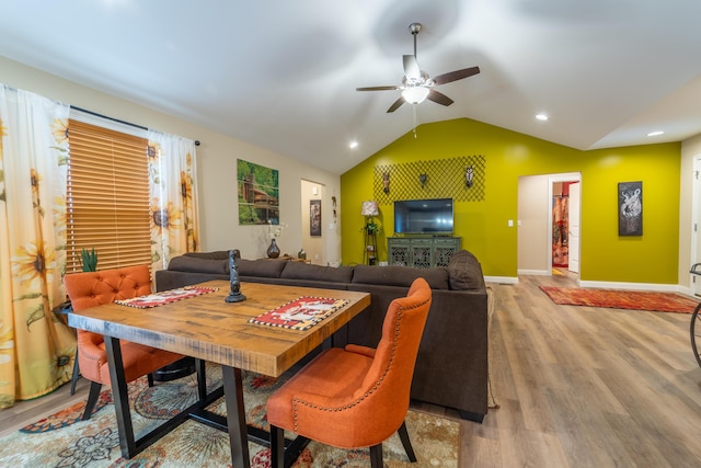 dining space with ceiling fan, vaulted ceiling, wood finished floors, baseboards, and recessed lighting