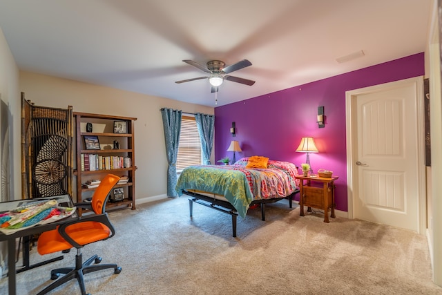 carpeted bedroom featuring a ceiling fan and baseboards