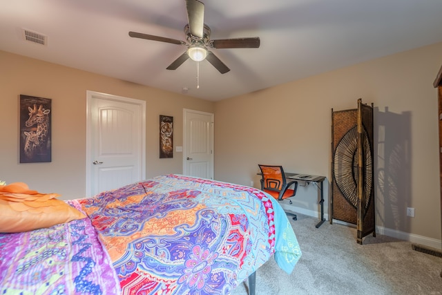 bedroom featuring carpet flooring, a ceiling fan, baseboards, and visible vents