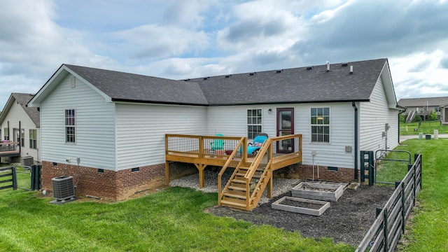 rear view of property featuring a yard, crawl space, fence, and roof with shingles