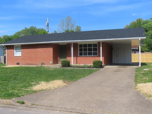 ranch-style home with a front lawn, fence, an attached carport, brick siding, and crawl space