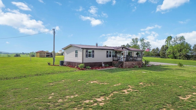 2805 W W Ridge Rd, Eubank, KY 42567 - rear view of house with a yard and metal roof