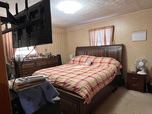 bedroom with crown molding, a textured ceiling, wallpapered walls, and carpet flooring