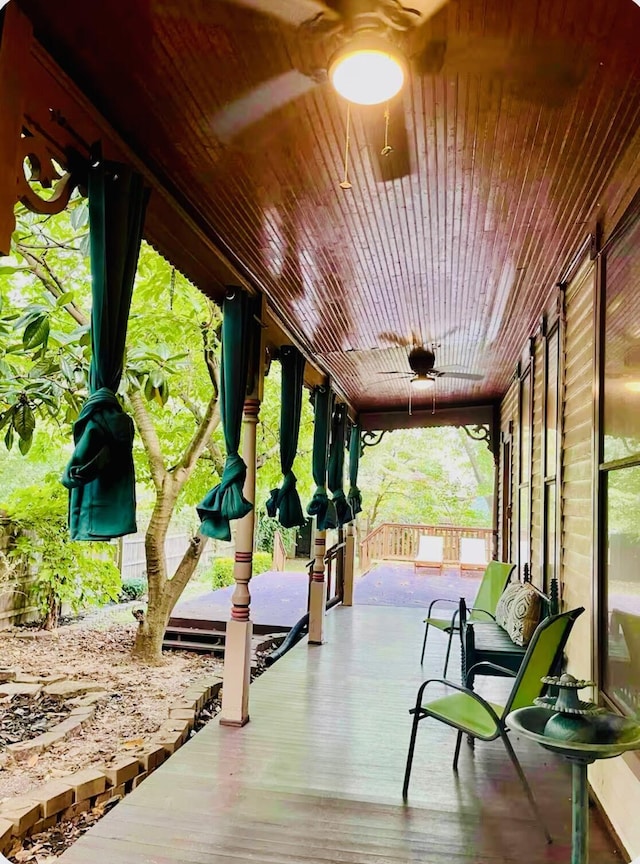 exterior space with covered porch and ceiling fan