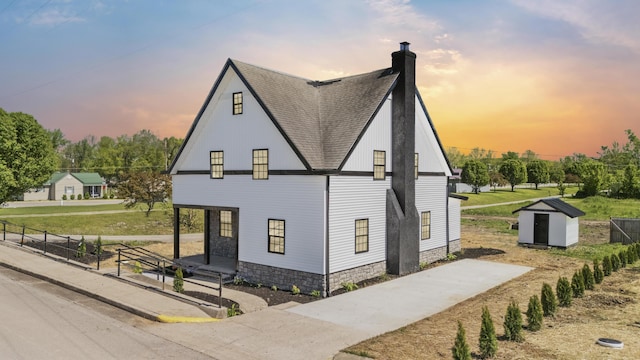 262 Main St, Salt Lick, KY 40371 - view of front of property with a shingled roof and a chimney