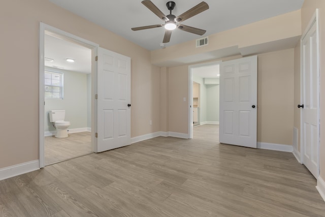 262 Main St, Salt Lick, KY 40371 - unfurnished bedroom with light wood-type flooring, ensuite bath, baseboards, and ceiling fan