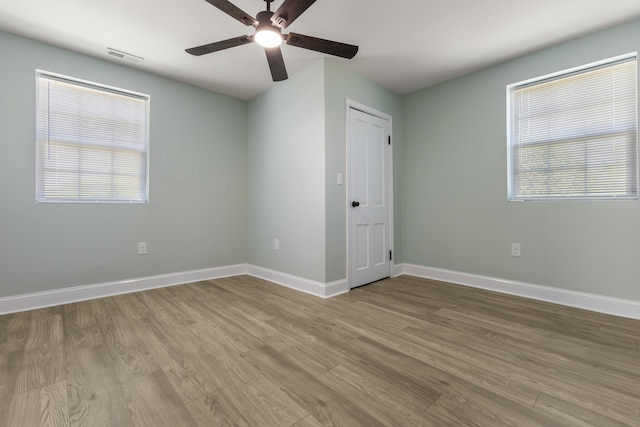262 Main St, Salt Lick, KY 40371 - unfurnished bedroom with wood finished floors, baseboards, and a ceiling fan