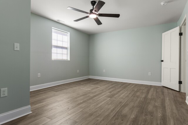 262 Main St, Salt Lick, KY 40371 - spare room featuring dark wood-style flooring, ceiling fan, a smoke detector, and baseboards