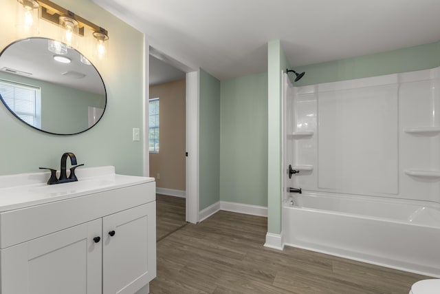 262 Main St, Salt Lick, KY 40371 - full bath featuring vanity, baseboards, wood finished floors, and shower / bathtub combination