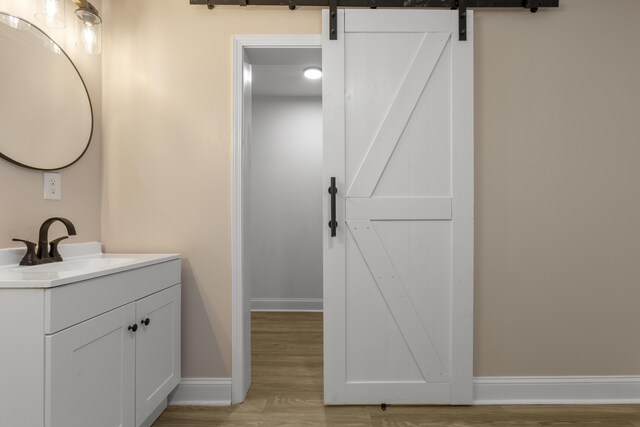 262 Main St, Salt Lick, KY 40371 - bathroom featuring vanity, baseboards, and wood finished floors