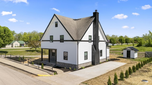 262 Main St, Salt Lick, KY 40371 - view of home's exterior with roof with shingles and a chimney