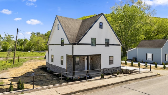 262 Main St, Salt Lick, KY 40371 - modern farmhouse style home featuring a porch, roof with shingles, and stone siding