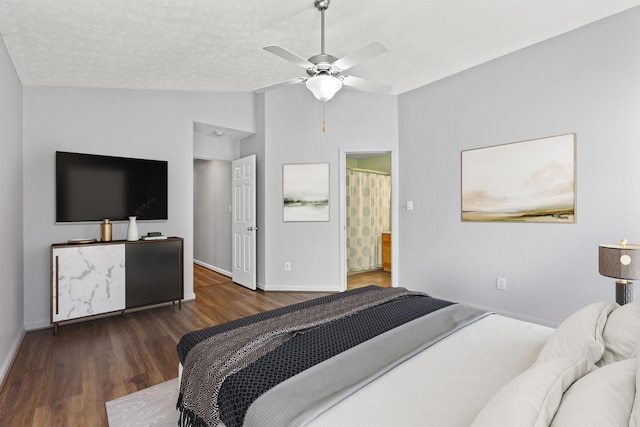 bedroom featuring baseboards, ceiling fan, vaulted ceiling, and wood finished floors