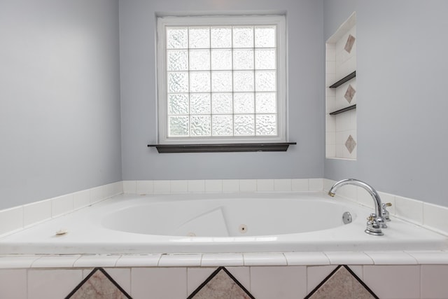 full bath with a jetted tub and a wealth of natural light
