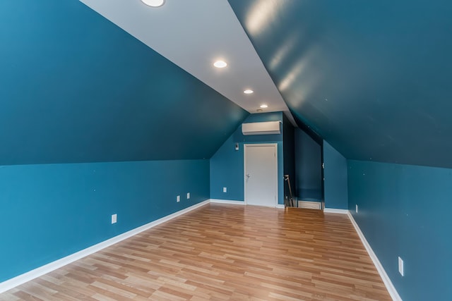 additional living space featuring recessed lighting, baseboards, light wood finished floors, and lofted ceiling