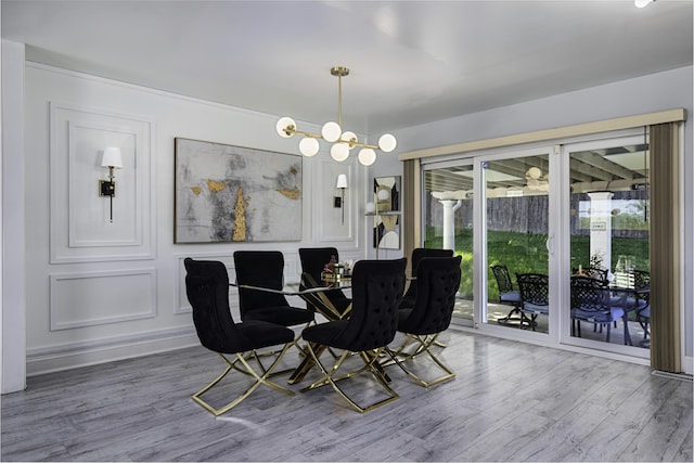 dining area featuring a healthy amount of sunlight and wood finished floors