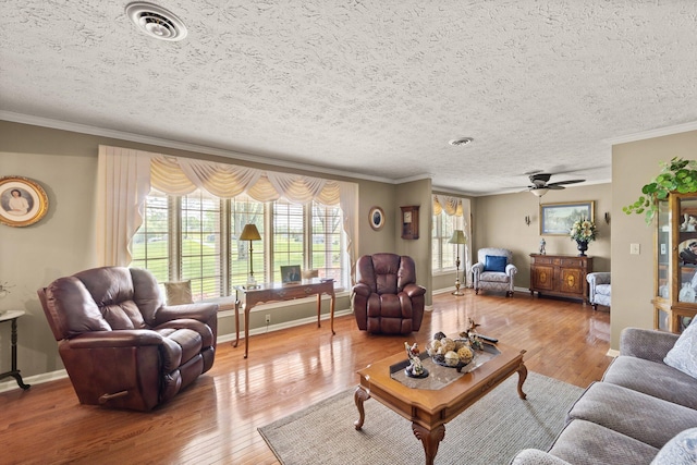 223 Lanetown Rd, Nancy, KY 42544 - living room with crown molding, visible vents, and wood finished floors