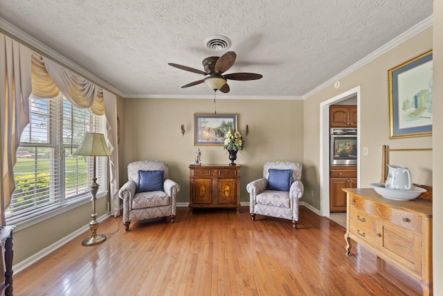 223 Lanetown Rd, Nancy, KY 42544 - sitting room featuring ceiling fan, visible vents, baseboards, light wood-style floors, and ornamental molding
