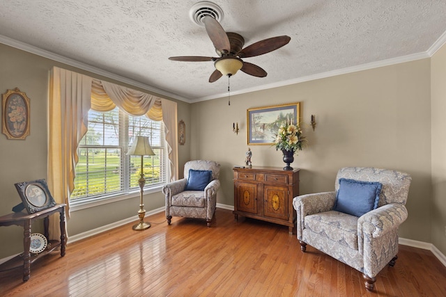 223 Lanetown Rd, Nancy, KY 42544 - living area featuring ceiling fan, a textured ceiling, visible vents, light wood-type flooring, and ornamental molding