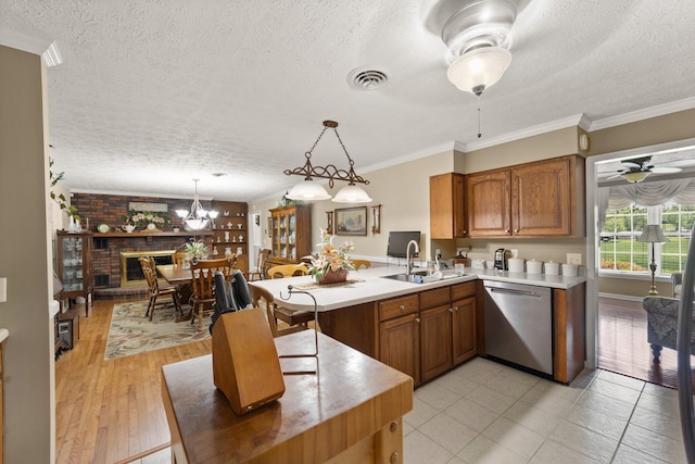 223 Lanetown Rd, Nancy, KY 42544 - kitchen with stainless steel dishwasher, a peninsula, a textured ceiling, and a sink