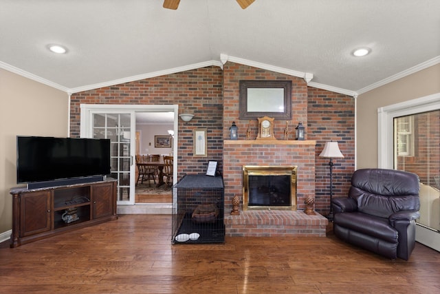 223 Lanetown Rd, Nancy, KY 42544 - living area featuring a ceiling fan, vaulted ceiling, wood finished floors, and a brick fireplace