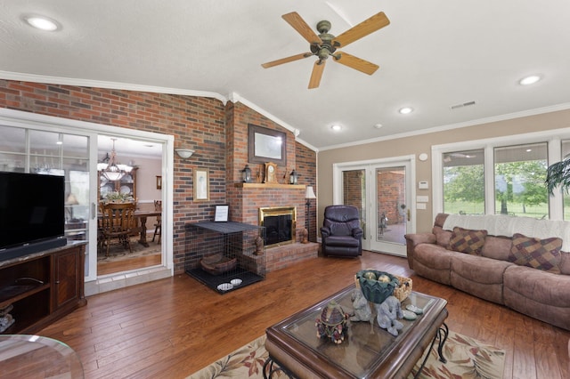 223 Lanetown Rd, Nancy, KY 42544 - living area with visible vents, lofted ceiling, wood finished floors, and brick wall