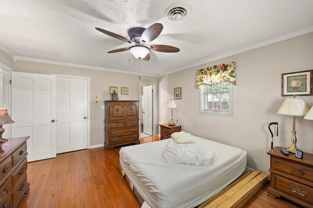 223 Lanetown Rd, Nancy, KY 42544 - bedroom featuring crown molding, a ceiling fan, visible vents, and light wood-style flooring