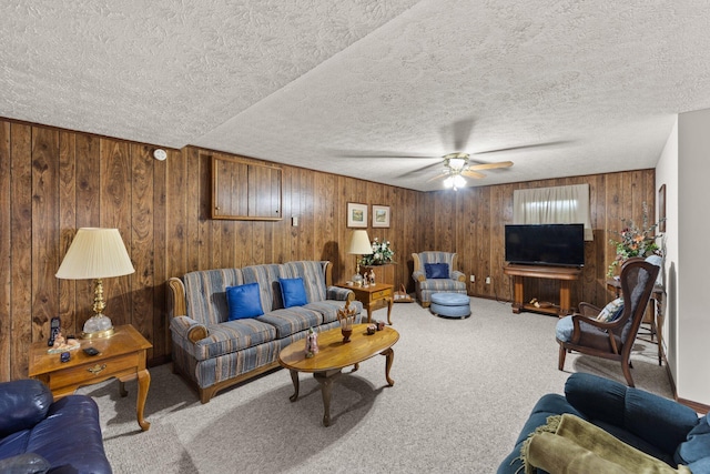 223 Lanetown Rd, Nancy, KY 42544 - carpeted living area with wooden walls, a ceiling fan, and a textured ceiling