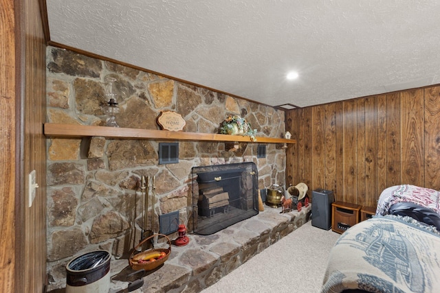223 Lanetown Rd, Nancy, KY 42544 - carpeted bedroom with crown molding, wooden walls, a textured ceiling, and a fireplace