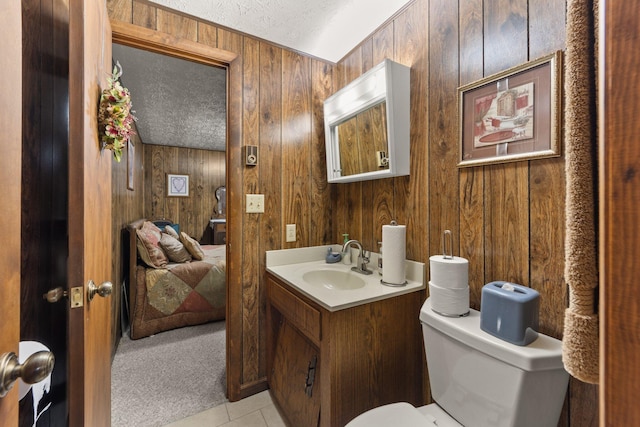 223 Lanetown Rd, Nancy, KY 42544 - bathroom featuring tile patterned flooring, wooden walls, toilet, and vanity