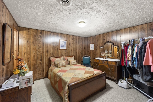 223 Lanetown Rd, Nancy, KY 42544 - bedroom with wooden walls, a textured ceiling, and light colored carpet