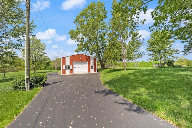 223 Lanetown Rd, Nancy, KY 42544 - exterior space with an outbuilding, driveway, a front yard, and a detached garage