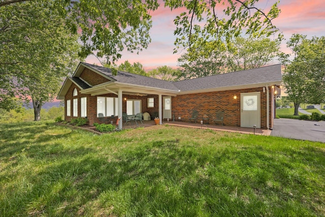 223 Lanetown Rd, Nancy, KY 42544 - view of front facade featuring brick siding, a patio area, and a front lawn